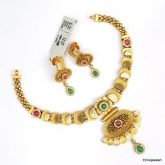 Vintage 22K Yellow Gold Choker Necklace with Earrings. Made of 22K Solid Gold and Set with Gemstones. Weight-34.390 Grams, Length-19 cm, Width-5.5 cm. Earrings-3.5 cm 22k Gold Dual-tone Jewelry For Wedding, Dual-tone 22k Gold Wedding Jewelry, Gold Dual-tone Kundan Necklace Gift, Dual-tone Gold Bridal Necklace As Gift, Gold Dual-tone Bridal Necklace As Gift, Gold Dual-tone Bridal Necklace For Gift, Traditional Dual-tone Gold Jewelry Sets, Traditional Gold Dual-tone Bridal Necklace, Traditional Gold Bridal Necklace With Dual-tone