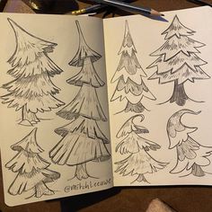 an open notebook with trees drawn on it