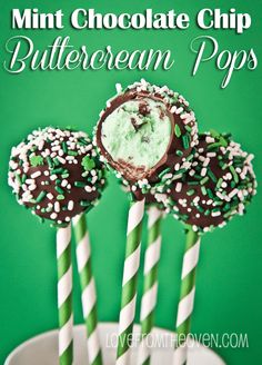 chocolate dipped buttercream pops with sprinkles in a white bowl on a green background