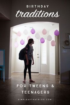 a woman standing in front of a doorway with balloons