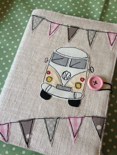 an appliqued piece of fabric with a vw bus on it