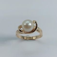 This handmade, beautiful Pearl ring has been expertly crafted in warm 10k yellow Gold , authentic pearl . This gorgeous ring will make a great special occasion/ birthday gift. All of my jewelry is handmade from scratch, one item at a time as I like to make sure I am producing a high quality item. A tracking shipping number will be provided to you once the ring has been shipped. Pearl measurements:  White Pearl: 7.55 mm Ring size : 6.5 Ring Weight: 3.3 grams Ring Band at smallest point: 2.34 mm R Anniversary Yellow Gold Rings With Pearl Drop, 14k Gold Pearl Drop Rings For Anniversary, 14k Gold Rings With Pearl Drop, Gold Pearl Birthstone Ring, Heirloom Gold Pearl Ring With Birthstone, Gold Pearl Ring Stamped 14k As Gift, Heirloom Gold Pearl Rings, Pearl Wedding Rings, Gold Ring With Pearl