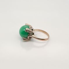 A very fine 14k gold and jade bead Art Deco style ring.  With a large jadeite bead prong set in a 14k gold architectural setting.  Simply a wonderful ring!  Date: Early to Mid 20th Century  Overall Condition: It is in overall good, as-pictured, used estate condition. There is mottling and a fine natural fissure visible to the top of the stone, as well as some very fine & light surface scratches and other signs of expected light wear consistent with age.  Fineness: Marked 14K for gold fineness. Jade Beads, Art Deco Style, Bead Art, Deco Style, Art Deco Fashion, Prong Setting, Jewelry Art, 20th Century, Jade