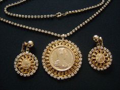 "This is a Gorgeous Vintage BERGERE Jewelry Set Shiny Gold Tone Metal M Maria Theresia D G R IMP HU BO REG Faux Coin Pendant Graduated Rhinestones Chain Necklace and Clip on Back Coins Earrings This beautiful set is in very good to excellent vintage condition with very minor/little signs of wear if any. The gold tone finish is so bright clean and ready to wear!.. The rhinestone chain measures approx: 31\" long pendant coin 2-1/4\" across and each earring is 17/8\" by 1-1/4\". Each earring signed Gold Coin Earrings, Rhinestone Chain, Coin Earrings, Gold Chain Jewelry, Jeans Diy, Monogram Design, Long Pendant, Coin Pendant, Gold Coins