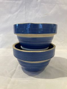 three blue bowls stacked on top of each other