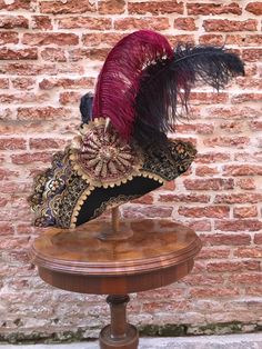 Historical tricorn hat with plumes, richly decorated. Complete your dress with this wool hat, created in our Atelier in Venice. Our tricorn-hat are made of wool and metal and are suitable for any size. They match perfectly with wigs. However you can wear them also without wig. All our hats are hand made and hand-decorated in our Atelier. This hat has been decorated with feathers, Swarovski crystals, trimming, lace. Size: please, choose the measure of the circumference of your head. Also, at the Traditional Costume Hats And Headpieces For Carnival, High Crown Hats For Carnival Costume, Curved Brim Costume Hat For Carnival, Curved Brim Carnival Costume Hat, Curved Brim Hats For Carnival Costume, Victorian Curved Brim Costume Hat, Carnival Hat Headpiece, Traditional Carnival Costume Headpieces, Tall Crown Costume Hats And Headpieces For Carnival