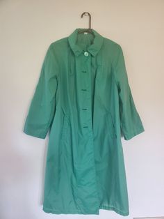 Vintage 1970s green Raincoat This gorgeous 70s green raincoat is definitely a statement piece! Unfortunately, it is missing the detachable hood. Alligator brand, size 8 Green Long Sleeve Raincoat For Spring, Green Long Sleeve Spring Raincoat, Green Raincoat For Winter Workwear, Green Winter Raincoat For Workwear, Green Winter Raincoat For Work, Green Long Sleeve Outerwear For Rainy Season, Retro Green Outerwear For Spring, Retro Green Spring Outerwear, Green Spring Workwear Raincoat