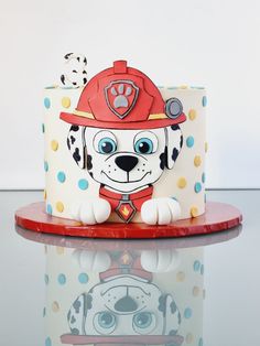 a cake with a fireman's dog on it