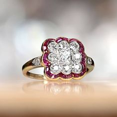 Lorraine Ring. Circa 1905 (Edwardian Era) - Ruby Halo Antique Cushion Cut Diamond Ring, Cushion Rings, Diamond And Ruby Ring, Antique Cushion Cut Diamond, Two Tone Engagement Rings, Antique Cushion Cut, Estate Diamond Jewelry, Edwardian Ring, Half Bezel