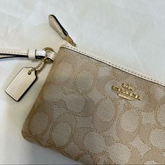 Coach Corner Zip Wristlet In Signature Canvas. Color Is Light Khaki/Chalk. Gold Hardware. Never Used. Nwt. Elegant Beige Clutch Wristlet, Adjustable Beige Rectangular Wristlet, Coach Beige Bag With Zipper Pouch, Coach Beige Pouch Wristlet, Beige Coach Pouch Wristlet, Coach Gold Clutch Wristlet, Elegant Beige Wallet With Zipper Pouch, Beige Clutch Wristlet With Zipper, Beige Wristlet Clutch With Zipper Closure