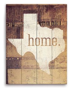 a wooden sign with the word home painted on it's side, in texas