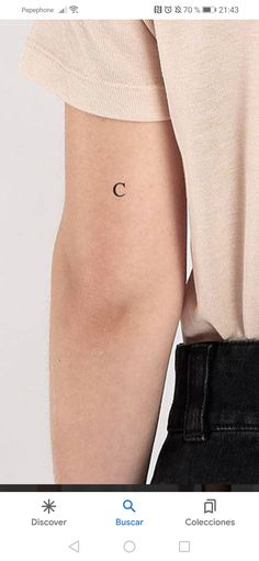 a person with a small crescent tattoo on their left side arm and the other half of her leg