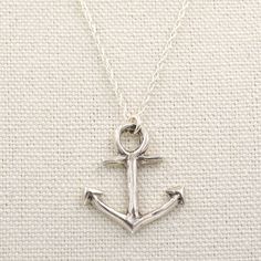 Anchors aweigh! Handcrafted anchor is an original Valerie Morgan Designs original! Bronze anchor dangles from an oxidized sterling silver chain with front S hook clasp and large ring. Beautiful mixed-metal edgy aesthetic. It adds a little bit of fun to your neck stack! .925 Oxidized/darkened sterling silver chain and front toggle clasp. Sterling anchor is 100% .925 sterling silver with a polished finish and hangs along a sterling silver rope chain with an S hook clasp Anchor measures approximate Anchor Jewelry, Pressed Metal, Edgy Aesthetic, Anchor Necklace, Hook Clasp, Large Ring, Metal Clay, Oxidized Sterling Silver, Solid Metal