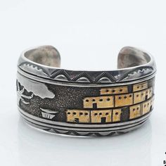 Floyd Namingha Lomakuyvaya Native Hopi Storyteller Sterling Silver Cuff Bracelet Floyd Namingha Lomakuyvaya Native Hopi Storyteller Sterling Silver Cuff Bracelet ........................................... Metal: Sterling .925 Silver Weight: 62.5 grams Measurements: 2.2" inside diam. 1.1" width 1.1" gap *The Southwestern Sterling Storyteller Cuff Bracelet is a beautiful and unique piece of jewelry that celebrates the art and tradition of storytelling in Southwestern culture. This bracelet is handcrafted from high-quality sterling silver and features an intricate design of adobe homes next to a lone tree etched into the silver. *P L E A S E * S E E * P H O T O S ! ........................................... If you should have any questions or concerns, please feel free to message us Monday Adjustable Cuff Bangle For Ceremonial Occasions, Traditional Adjustable Etched Cuff Bracelet, Adjustable Cuff Bracelet For Ceremonial Festivals, Traditional Stamped Cuff Bangle, Traditional Adjustable Cuff Bangle, Southwestern Adjustable Jewelry For Festivals, Adjustable Cuff Bangle In Traditional Style, Traditional Etched Cuff Bangle, Traditional Etched Cuff Bracelet