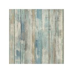 an old wooden wallpaper with blue and white paint on the wood paneled walls