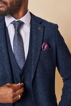 This men's navy tweed blazer is a perfect blend of style and sophistication. Made from a premium wool poly mix fabric, this blazer is sure to make an impact wherever you go and is sure to last for years to come. Upgrade your everyday look with this timeless piece. Perfect for workwear or wedding attire. Model wears size 38R. Features Slim fit Fully lined Single-breasted Peak lapel Single back vent Four button cuff Double button fastening Complimentary pocket square Functional inside and outside Navy Suit Wedding, Wedding Waistcoats, Tweed Wedding Suits, Black Suit Wedding, Tan Suit, Tweed Waistcoat, Tweed Trousers, Tweed Suit, Circle Print