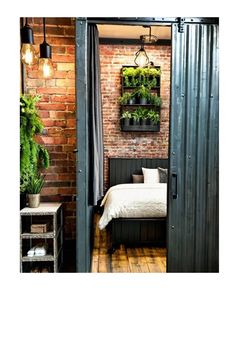 an open door leading to a bedroom with brick walls and wooden floors, potted plants on the wall