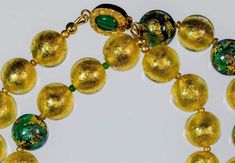 Gold and Green and 24K Gold Leaf Murano Necklace Gold Emerald Necklace With Round Beads For Festive Occasions, Gold Emerald Necklace With Polished Beads As Gift, Gold Czech Glass Single Strand Jewelry, Round Murano Glass Gold Jewelry, Gold Czech Glass Round Beads Jewelry, Gold Czech Glass Jewelry With Large Beads, Gold Jewelry With Large Czech Glass Beads, Gold Glass Single Strand Beaded Necklace, Gold Single Strand Czech Glass Necklace