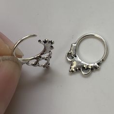 "These are so pretty and light. Made is 925 sterling silver with tribal details. The rings are all 10mm (1cm or .40\") in diameter. The wire is 18 gauge. They are only finished on one side since each one is made BY HAND so there may be very slight differences. One of the images contains numbers to specify which you would like from the drop down menu." Sterling Silver Septum Ring, Silver Pierced Round Cartilage Earrings, Nickel Free Silver Piercings, Nickel Free Round Silver Piercings, Nickel-free Round Silver Piercings, Adjustable Silver Toe Ring Body Jewelry, Nickel-free Sterling Silver Septum Ring, Silver Internally Threaded Hoop Body Jewelry, Adjustable Bohemian Sterling Silver Body Jewelry