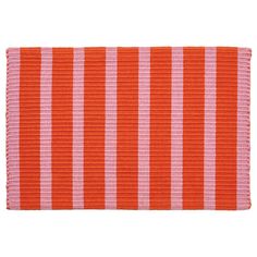 an orange and pink striped placemat on a white background with no people around it