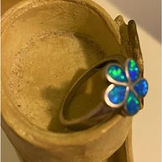 Elegant Silver Opal Ring Blue Flower-shaped Formal Jewelry, Elegant Adjustable Blue Flower Ring, Elegant Blue Adjustable Flower Ring, Elegant Blue Flower Ring As Gift, Blue Opal Open Ring In Sterling Silver, Blue Gemstone Flower Ring, Blue Flower Shaped Gemstone Ring, Blue Flower Gemstone Rings, Blue Flower-shaped Gemstone Ring