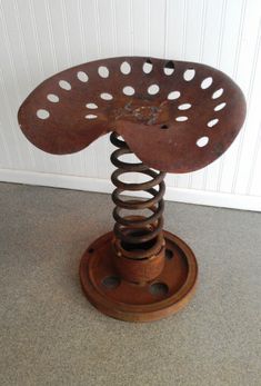 an old metal object sitting on top of a floor