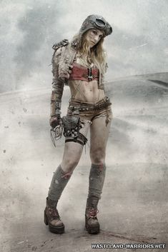 a woman in steam punk clothing and goggles posing for the camera with her hands on her hips