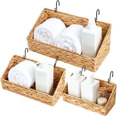 two baskets with towels and soaps in them