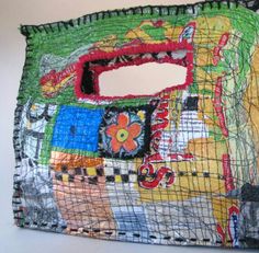 this is an image of a bag made out of fabric and wire with pictures on it