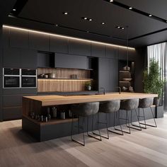 a modern kitchen with an island counter and bar stools