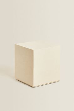 a white square object sitting on top of a table