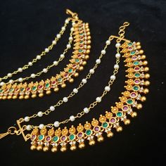 Handmade Indian Temple Jewelry, best to wear it for traditional ceremonies or Indian wedding. This bridal jewelry has an ethnic finish. It has Cubic Zircon stones with ruby and emeralds. It is a Bollywood style one gram jewelry. There are long and short patterns of Indian jewelry in Kundan, Pearls, CZ, American Diamond, ruby, emerald, Polki, kemp to suit every occasion of South Indian and North Indian weddings. These Chempaswaralu are elegantly designed, from the house of glam to add a hint of e Temple Jewelry Chandbalis With Stone Work For Navratri, Traditional Bridal Earrings With Stone Work For Navratri, Temple Jewelry Style Danglers With Stone Work For Navratri, Traditional Stone Work Jhumkas For Puja, Traditional Multi-stone Festive Jewelry, Diwali Bridal Earrings With Latkans For Rituals, Temple Jewelry Bridal Earrings With Stone Work, Traditional Bridal Earrings For Diwali, Traditional Bridal Earrings For Ceremonial Festivals