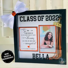 a graduation photo frame with a ribbon on it