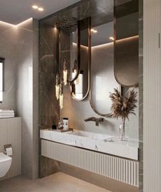 a modern bathroom with two sinks and three mirrors on the wall, along with a toilet