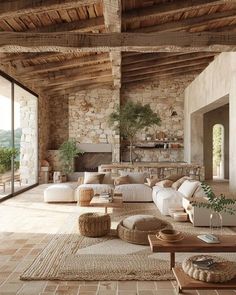 a living room filled with furniture and stone walls