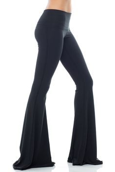 With a classic hue the Teeki Solid Black Bell Bottom will be your new go-to. This Teeki bell bottom offers an all new length 3 inches longer than the original style, allowing you to cut them to your perfect length! A chic Black hue makes the Teeki Bell Bottoms easy to wear and easy to pair with practically anything! Made of a soft recycled water bottle fabric, with breathability, and 4-way stretch, this pant ensures freedom of movement with minimal impact on the earth. With a Black Flare Wide Leg Pants, Black Flare Loungewear Pants, Black Flare Workout Pants, Flare Yoga Pants For Fall, Black Fitted Pants With Flared Hem, Trendy Stretch Full Length Flares, Flare Activewear In Elastane, Trendy Black Flared Hem Pants, Black Flare Bottoms For Loungewear