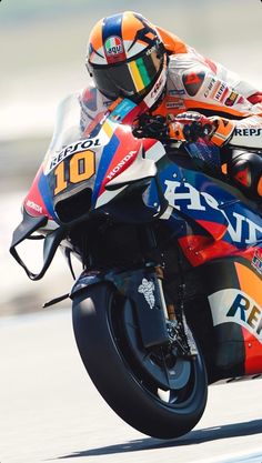 a man riding on the back of a motorcycle