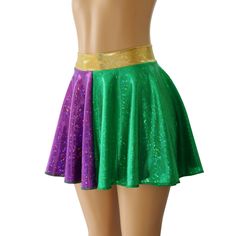 "Green and Purple Holographic Spandex Circle Skirt with a 2\" Hologram Wasitband. You are sure to be sparking at your next event in this sassy little skirt! WAISTBAND OPTIONS 1. GREEN HOLOGRAM 2. PURPLE HOLOGRAM 3. GOLD HOLOGRAM SKIRT LENGTHS Skirt Lengths: Front/Back Toddler 2/37\"/8\" Child X-Small 10\" / 11\" Child Small12\"/13\" Child 6X-711\"/12\" Child Medium13\"/14\" Child Large13\"/14\" Adult XS 13\"/14\" Adult Small 14.5\" / 16\" Adult Medium14.5\"/16\" Adult Large15\"/17\" Adult X-Larg Stretch Skirt For Cheerleading, Fitted Party Skirt With Elastic Waistband, Fitted Skirt With Elastic Waistband For Party, Green Stretch Skort For Party, Stretch Mini Skirt For Costume Party, Stretch Lined Mini Skirt For Cheerleading, Fitted Green Bottoms For Dance, Fitted Party Skort With Elastic Waistband, Fitted Green Bottoms For Costume Party