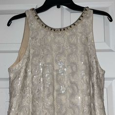 Never Worn With Tags! Gorgeous Badgley Mischka Beige/ Cream Sequin Dress. A-Line Dress, Scoop Neck With Beaded Accent Along The Neckline And Back. Beautiful For Any Occasion, Including Weddings! ***Example Photo Not Exact Material, But Used To Show Fit And Style Of The Dress. Beaded Cream Dress, Silver Sleeveless Embellished Sequin Dress, Chic Embellished Sequin V-neck Dress, Silver Embellished Sleeveless Sequin Dress, Beige Sleeveless Sequin Mini Dress, Embellished Stretch V-neck Dress, White Sequin Dress, Iridescent Dress, Badgley Mischka Dress