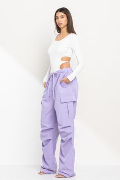 Be stylin with these Lavender wide led parachute pants! Not only do they feature functional side pockets, but also an elastic waistband with a drawstring for the perfect fit. Return Policy WE ONLY OFFER STORE CREDIT FOR RETURNS! Feel free to email us at info@shopluxxeapparel.com or DM us with any questions regarding fit, styling, or our return policy in general. To read more into our return policy please click here. Parachute Cargo Pants Outfit, Parachute Cargo Pants, Parachute Pant, Parachute Cargo, Pants Large, Wide Legs, Elastic Band, Cargo Pants, Parachute Pants