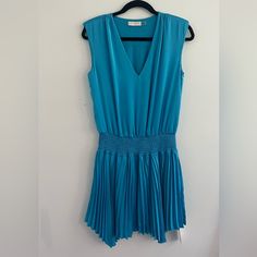 Alesia Pleated Satin Mini Dress By Blue Ramy Brook Size Extra Small Never Worn Ramy Brook Dress, Size Xs Chic Blue A-line Pleated Dress, Light Blue Pleated V-neck Dress, Blue V-neck Dress With Pleated Waist, Blue Knee-length Pleated Summer Dress, Blue Knee-length Pleated Dress For Summer, Blue V-neck Pleated Mini Dress, Blue Pleated Waist Dress For Spring, Blue Fitted Pleated Cocktail Dress, Blue Pleated Knee-length Mini Dress