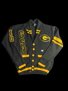 For a limited time, the Signature Brand is offering the GSU Varsity Pre-order Apparel: Cardigan uniquely designed with embroidered patches. Sizes are available in Small-4X. Pre-ordered apparel can take 25 days to manufacture and additional days to be receive in our inventory. There are no refunds on pre-ordered items (group/customized orders); please visit our website for additional FAQs: https://www.signaturebrandhtx.com/faq Again, thanks for your support. We can't wait to see you in our branded apparel!! Collegiate Cardigan For College In Fall, Collegiate Fall Cardigan For College, Collegiate Style Cardigan For Fall College Season, Fall Collegiate Style College Cardigan, Collegiate Style Fall Cardigan For College, Collegiate Long Sleeve Cardigan For College, Collegiate Fall Sweater With Embroidered Logo, Fall Collegiate Sweater With Embroidered Logo, Long Sleeve Collegiate Cardigan For College