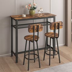 three stools and a table in a room