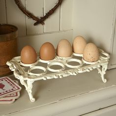 an egg tray with six eggs sitting on top of it