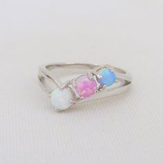 Vintage Sterling Silver White, Blue, Pink Opal Three stone Ring ...Marked 925...Total of weights 2.7grams...Size 7...Measure of Face 6.5MM...It's in very good condition. A#01 791 Three Stone Ring, Filigree Ring, Three Stone Rings, Multi Stone Ring, Pink Opal, Favorite Rings, 1980s Vintage, White Opal, Multi Stone