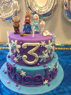 a frozen princess birthday cake with the number three on it