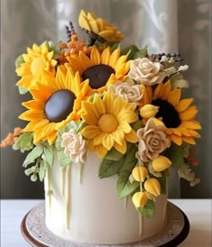 a cake decorated with sunflowers and other flowers