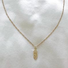 Delicate snake charm necklace with cubic zirconia details. The perfect necklace to wear alone or layer with other necklaces. 14k Gold Filled Chain 14k Gold Filled Charm Chain length: 20” Lobster clasp closure Hypoallergenic Water resistant & tarnish free Nickel & lead free Gold Charm Necklace With Delicate Snake Chain, Elegant Charm Necklace With Snake Chain, Minimalist Yellow Gold Snake Chain Charm Necklace, Dainty Yellow Gold Snake Chain Charm Necklace, Elegant Gold Snake Chain Charm Necklace, Cute Necklace, Sustainable Jewelry, Cross Pendant Necklace, Gold Jewelry Fashion