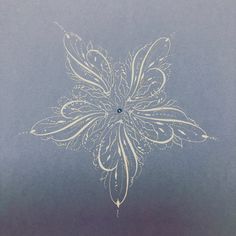 a white flower on a blue background with some lines in the middle and one line at the bottom