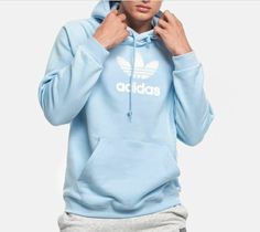 NEW MEN'S ADIDAS ORIGINALS PREMIUM TREFOIL HOODIE  SIZE MEDIUM   PLEASE VIEW MY FEEDBACK- ALL ITEMS ARE GUARANTEED 100% AUTHENTIC ADIDAS, BUYER SATISFACTION IS GUARANTEED                 TREFOIL HOODIE A COZY HOODIE THAT SHOWS OFF ADIDAS PRIDE. Branded with a textured touch of bouclé at the chest, this adidas hoody is a sky blue style that’s made from pure cotton jersey. A French terry staple, its cosy construction is equipped with a front pouch pocket and ribbed trims wrap comfortably around it Blue Hoodie Outfit, Hoodie Outfit Men, Mens Adidas, A Sky, Cozy Hoodie, Hoodie Outfit, Blue Style, Blue Hoodie, Kangaroo Pouch